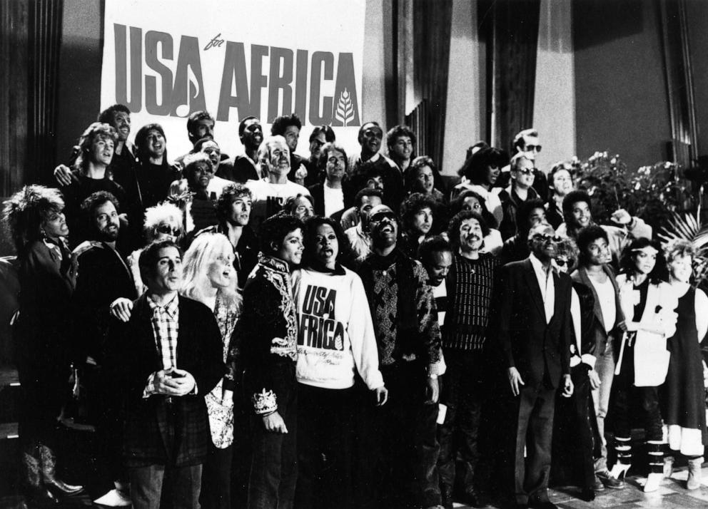 PHOTO: Tina Turner, Billy Joel, Cyndi Lauper, Paul Simon, Michael Jackson, Diana Ross, Stevie Wonder, Quincy Jonesand many other celebrities sing "We Are The World," in 1985.
