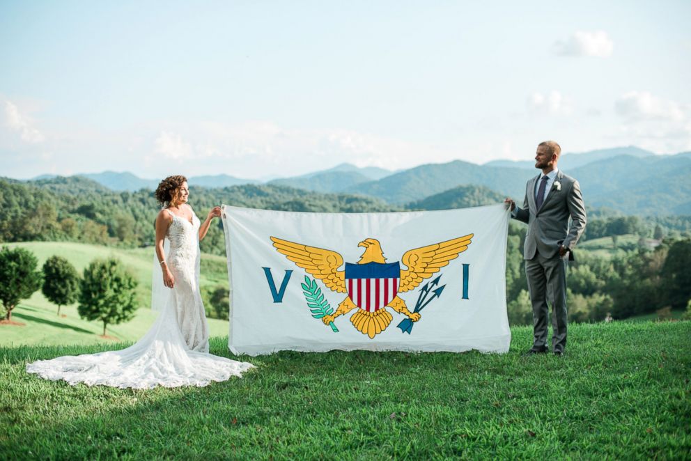 PHOTO: Newlyweds Marty Bruckner and Lauren Saia pose with a U.S Virgin Islands flag.