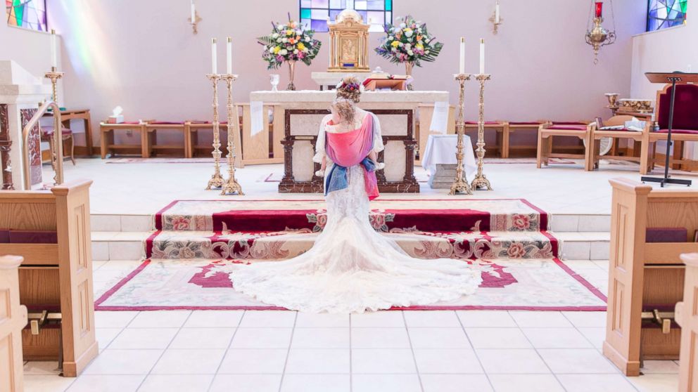 PHOTO: Dalton Butts is pictured wearing her baby Elllora at her wedding. 