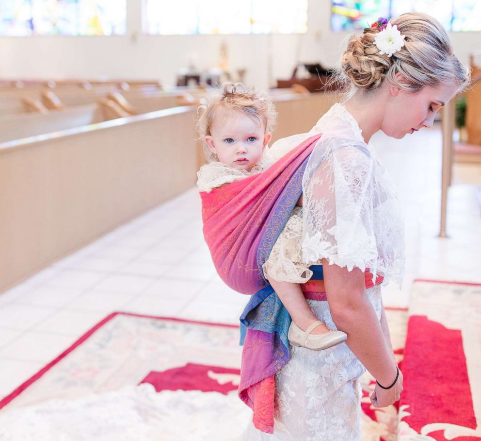 PHOTO: Dalton Butts is pictured wearing her baby Elllora at her wedding. 