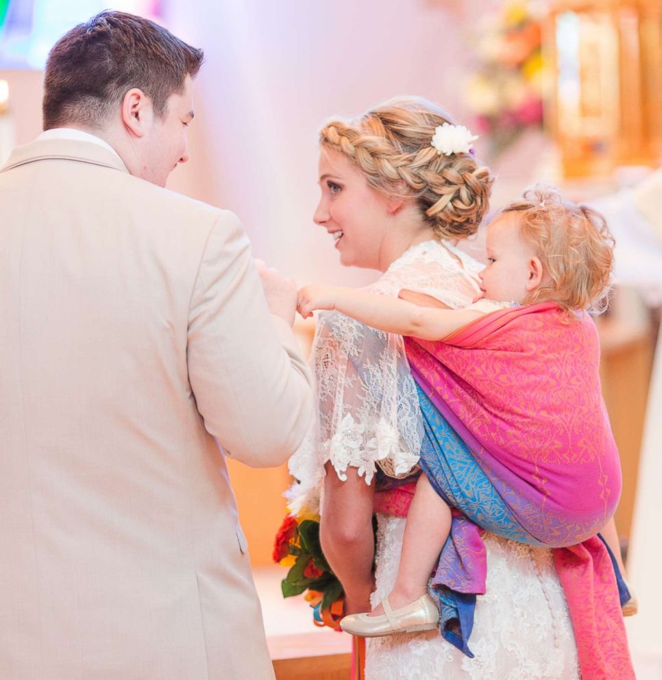 PHOTO: Dalton Butts is pictured wearing her baby Elllora at her wedding. 