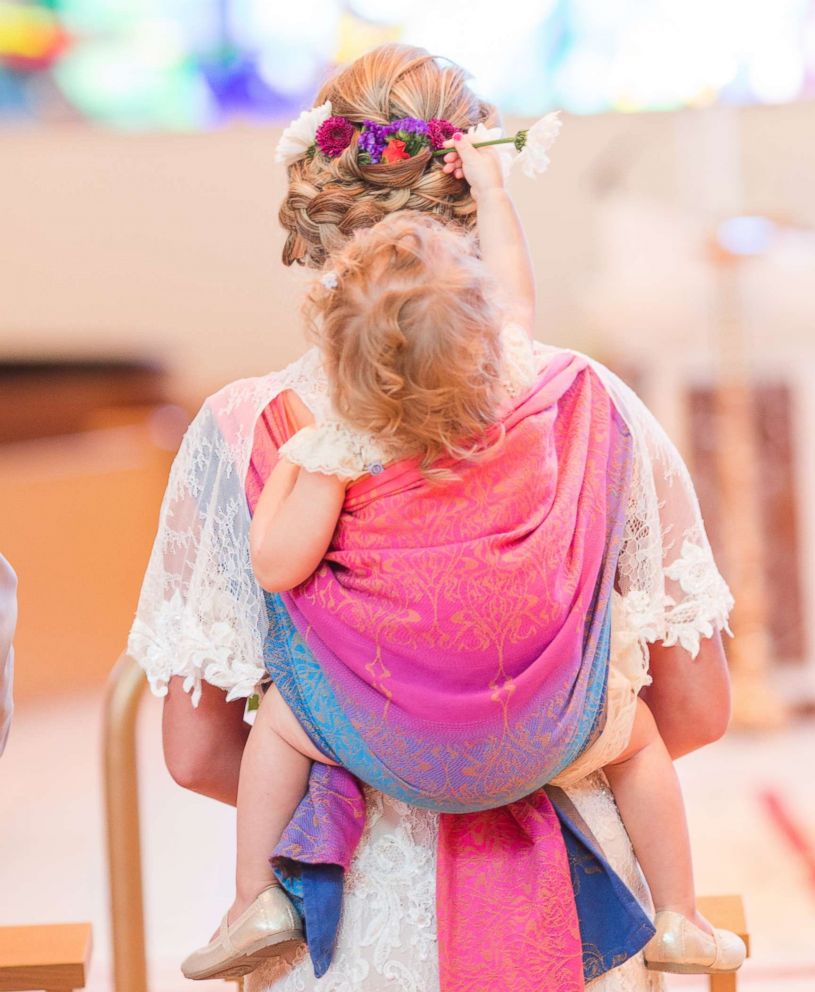 PHOTO: Dalton Butts is pictured wearing her baby Elllora at her wedding. 