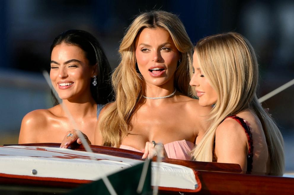 PHOTO: Brooks Nader and British singer and songwriter Ellie Goulding leave the Gritti Palace Hotel on the wedding day of Amazon founder Jeff Bezos with Lauren Sanchez, in Venice, on June 27, 2025.