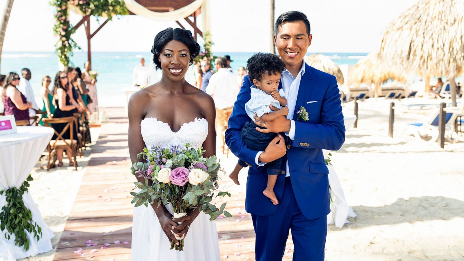 PHOTO: Bobbie and Alonzo walk down the aisle with their son after their dream destination wedding in Punta Cana.