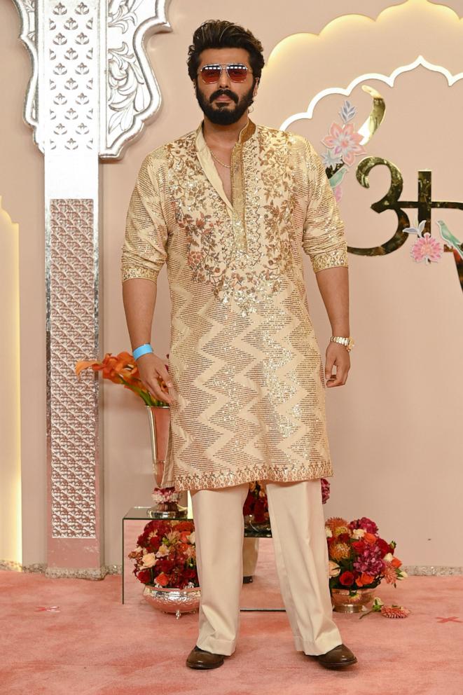 PHOTO :Bollywood actor Arjun Kapoor poses for photos as he arrives to attend the wedding ceremony of billionaire tycoon and Chairman of Reliance Industries Mukesh Ambani's son Anant Ambani and Radhika Merchant in Mumbai on July 12, 2024. 