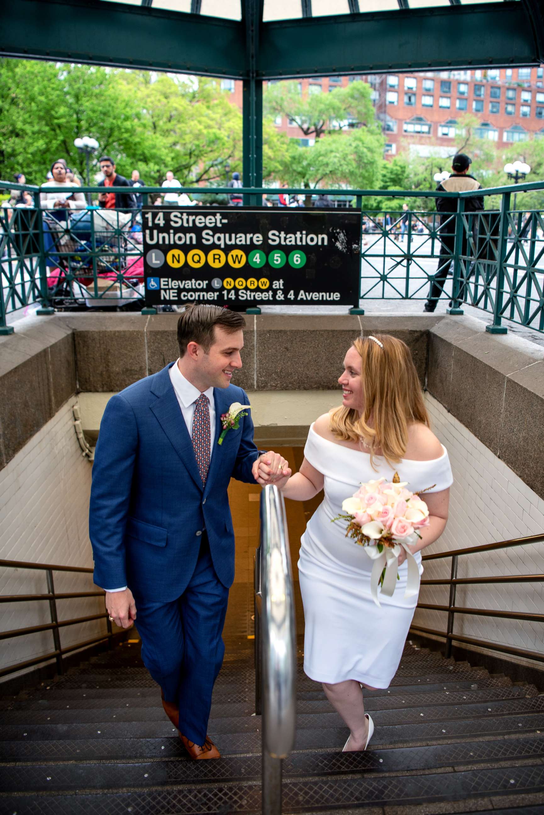 PHOTO: Newlyweds Robert Musso and Frances Denmark exit the subway in New York City following their ceremony.
