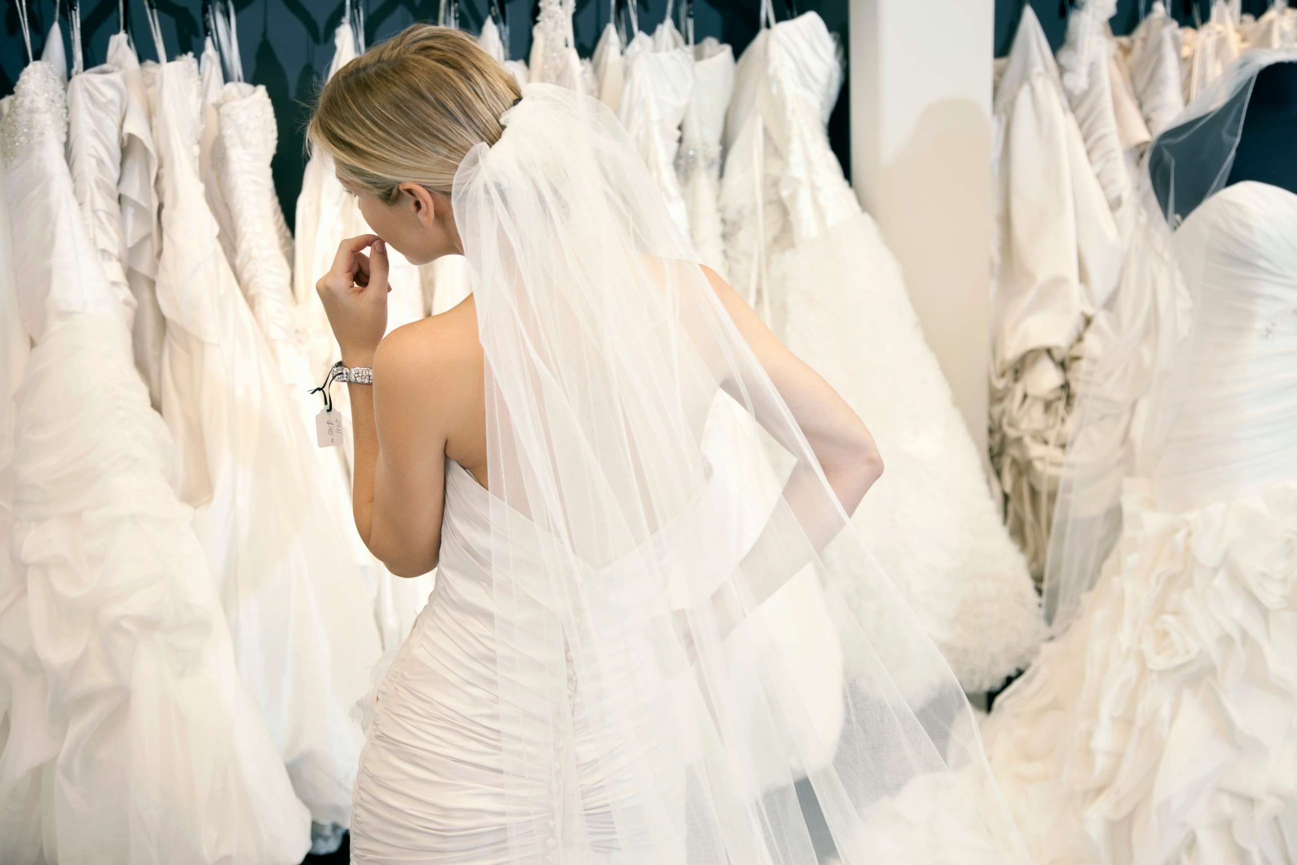 PHOTO: A woman looks at wedding dresses in this stock photo.