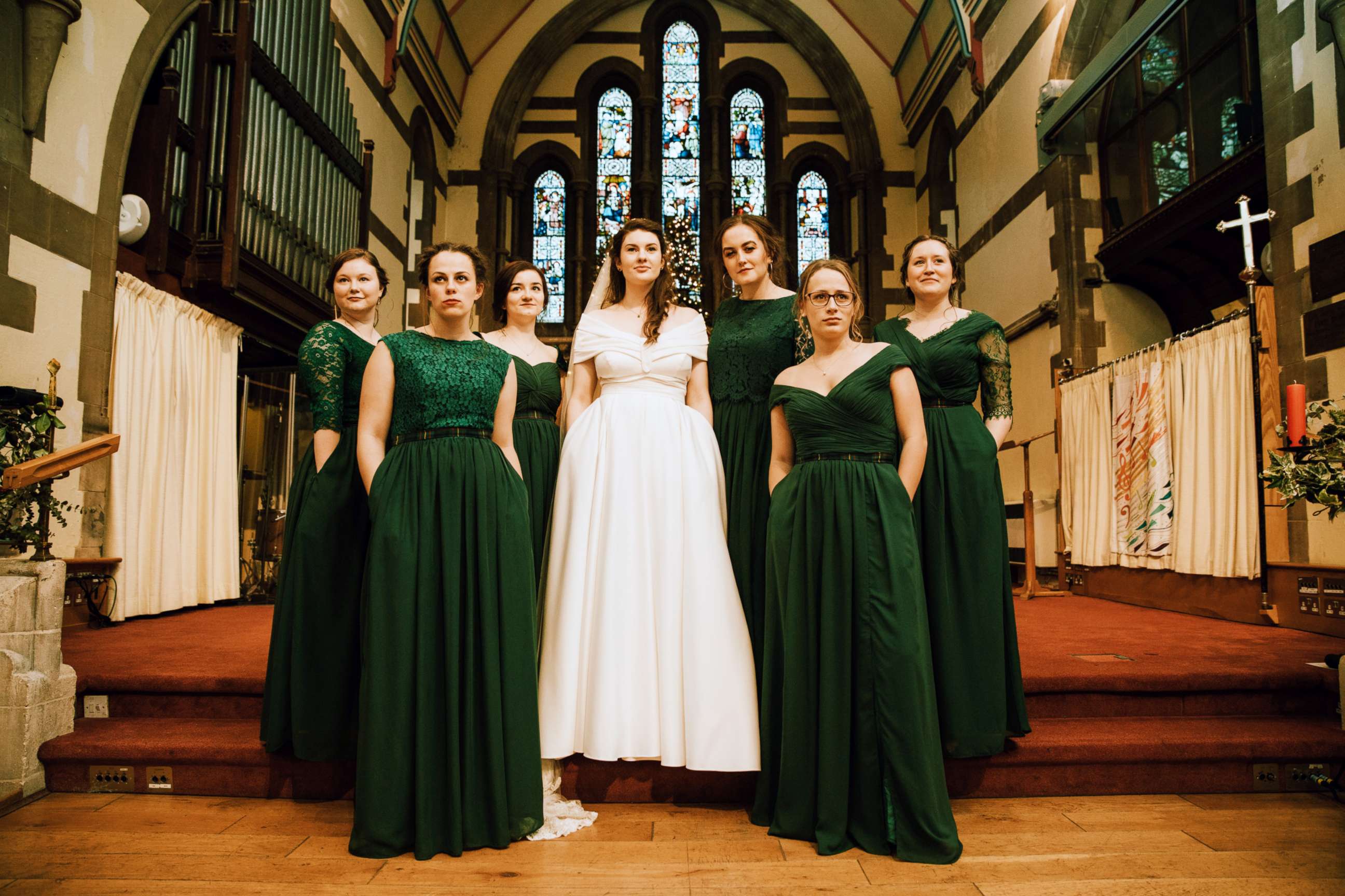 PHOTO: Evelyn Paterson, 24, showed off her dress pockets along with her bridesmaids on her December 8th, 2018, wedding day at All Saints Woodford Wells, North East London.
