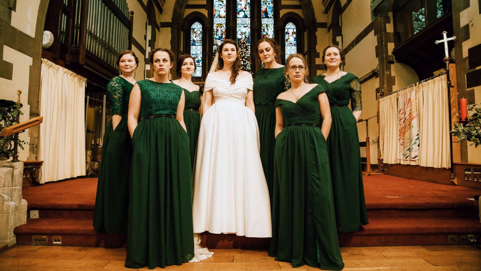 PHOTO: Evelyn Paterson, 24, showed off her dress pockets along with her bridesmaids on her December 8th, 2018, wedding day at All Saints Woodford Wells, North East London.