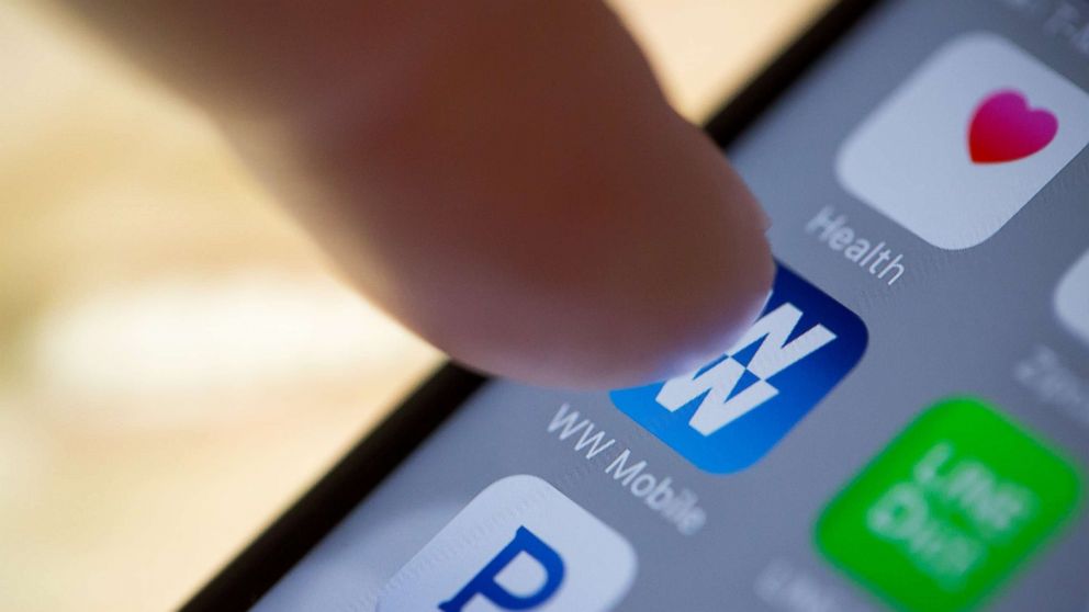 PHOTO: The Weight Watchers International Inc.'s mobile application is displayed on an  iPhone in N.Y., Feb. 24, 2016.