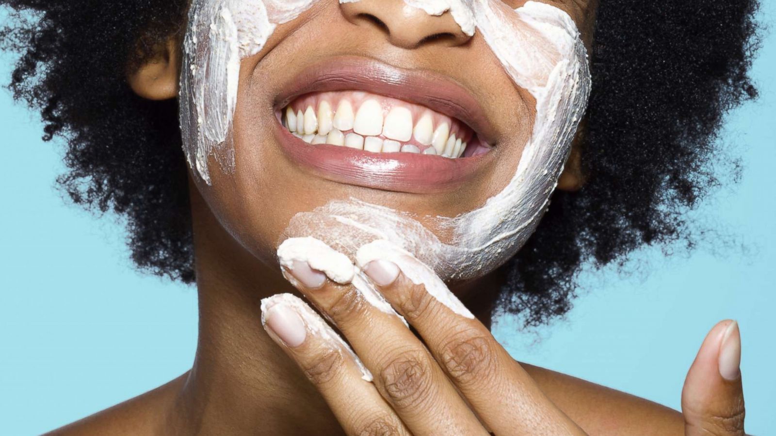 PHOTO: A woman applies a face mask in an undated stock photo.