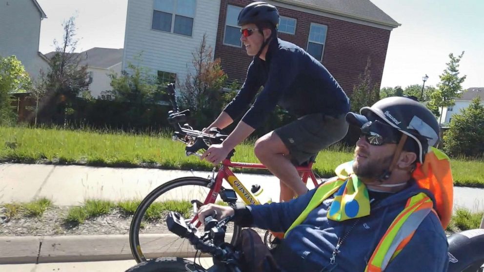 PHOTO: Will Reeve rides alongside Janne Kouri during his two-month journey across the country.