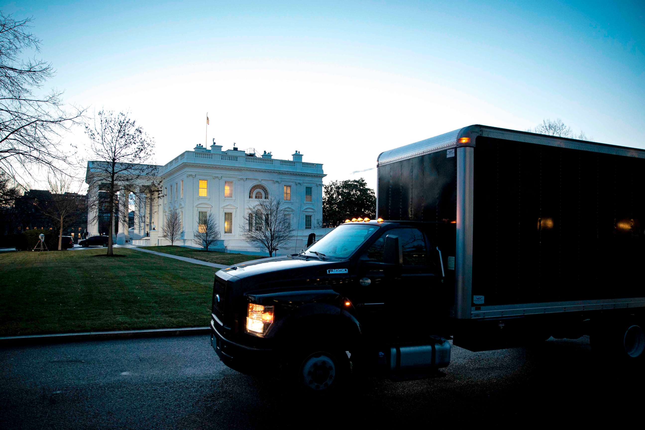 PHOTO: A moving truck departs outside of the West Wing of the White House at dawn, before the 59th Presidential Inauguration of President-elect Joe Biden in Washington, DC, Jan. 20, 2021.