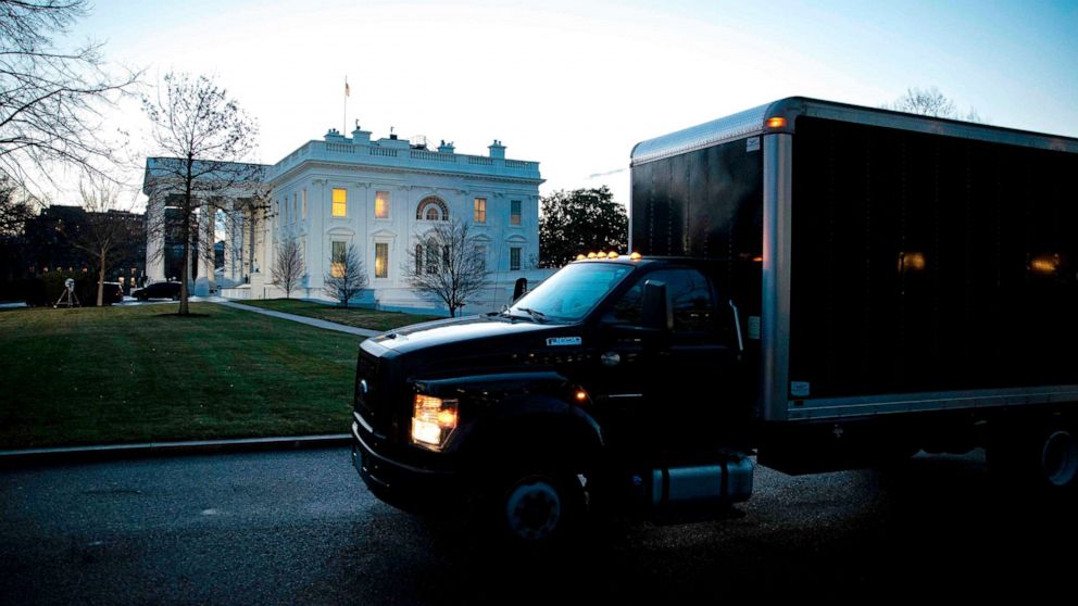 PHOTO: A moving truck departs outside of the West Wing of the White House at dawn, before the 59th Presidential Inauguration of President-elect Joe Biden in Washington, DC, Jan. 20, 2021.