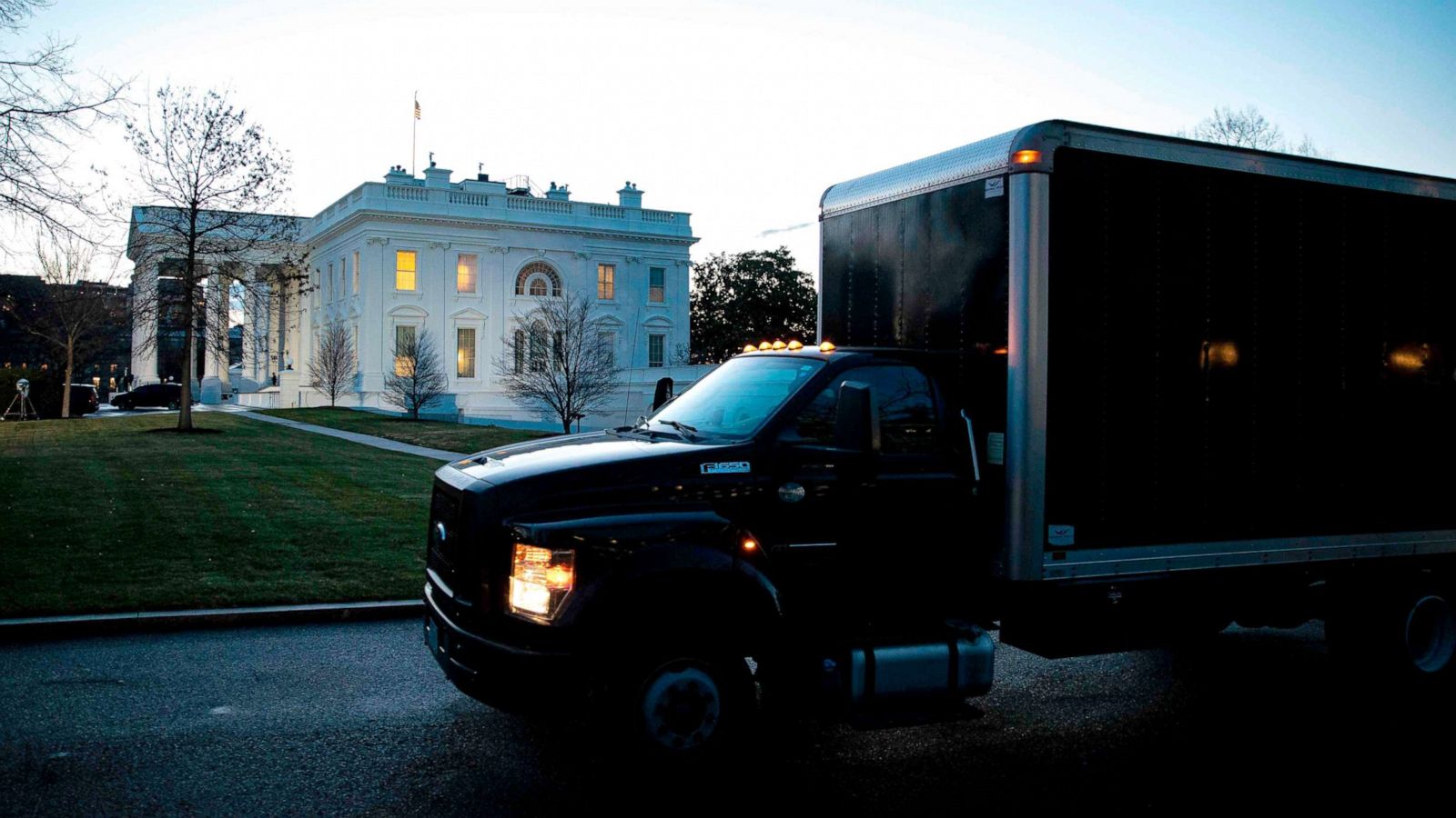 PHOTO: A moving truck departs outside of the West Wing of the White House at dawn, before the 59th Presidential Inauguration of President-elect Joe Biden in Washington, DC, Jan. 20, 2021.