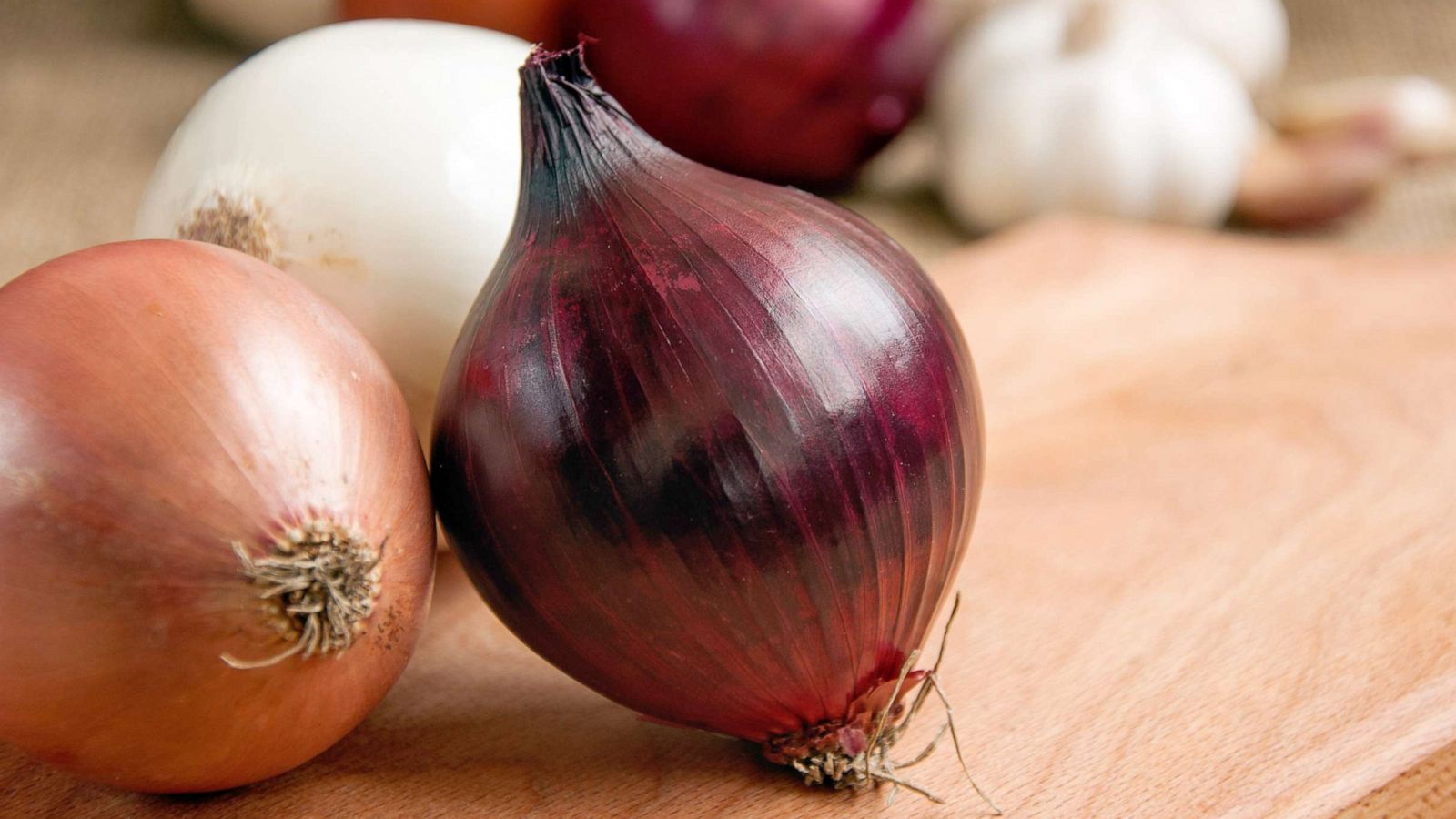 PHOTO: Onions are pictured on a board in a stock image.