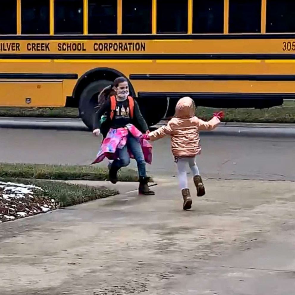 VIDEO: Mom shares adorable video of daughter welcoming sisters home rain or shine 