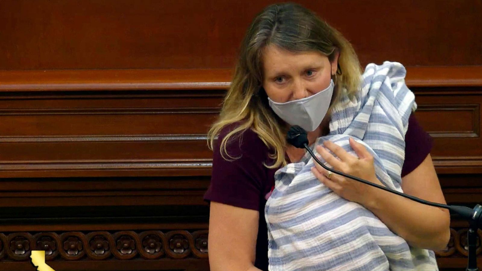 PHOTO: Assemblywoman Buffy Wicks, a Democrat from Oakland, addresses lawmakers on a housing bill while holding her one-month-old daughter Elly in her arms during the final hours of the California legislative session, Aug. 31, 2020, in Sacramento, Calif.