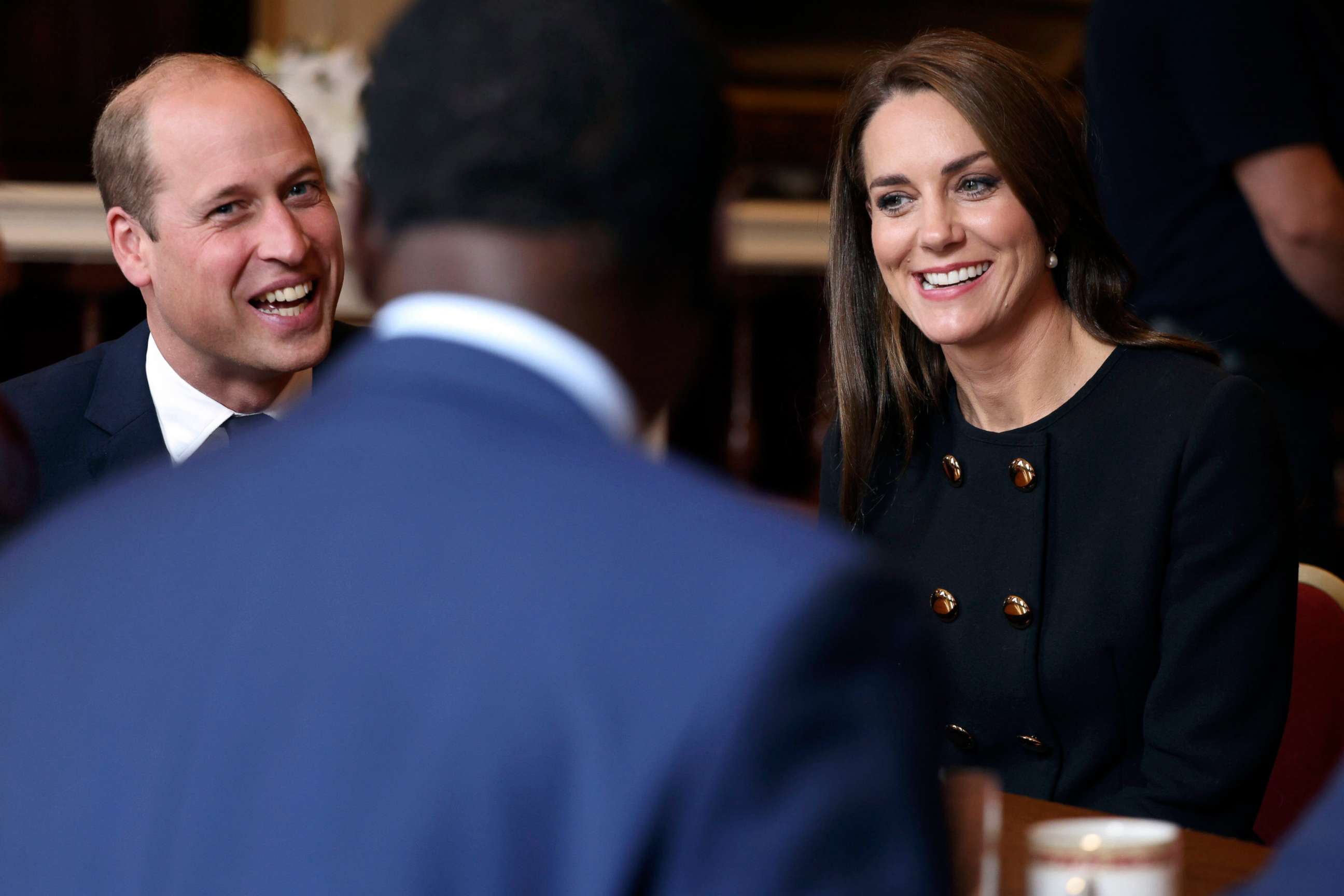 PHOTO: Prince William and Kate, Princess of Wales, meet volunteers and operational staff who were involved in facilitating the Committal Service for Queen Elizabeth II at St George's Chapel, at Windsor Guildhall, Berkshire, Sept. 22, 2022.