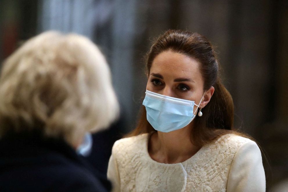 PHOTO: Britain's Catherine, Duchess of Cambridge speaks to health workers as she visits the coronavirus vaccination centre at Westminster Abbey, central London on March 23, 2021.