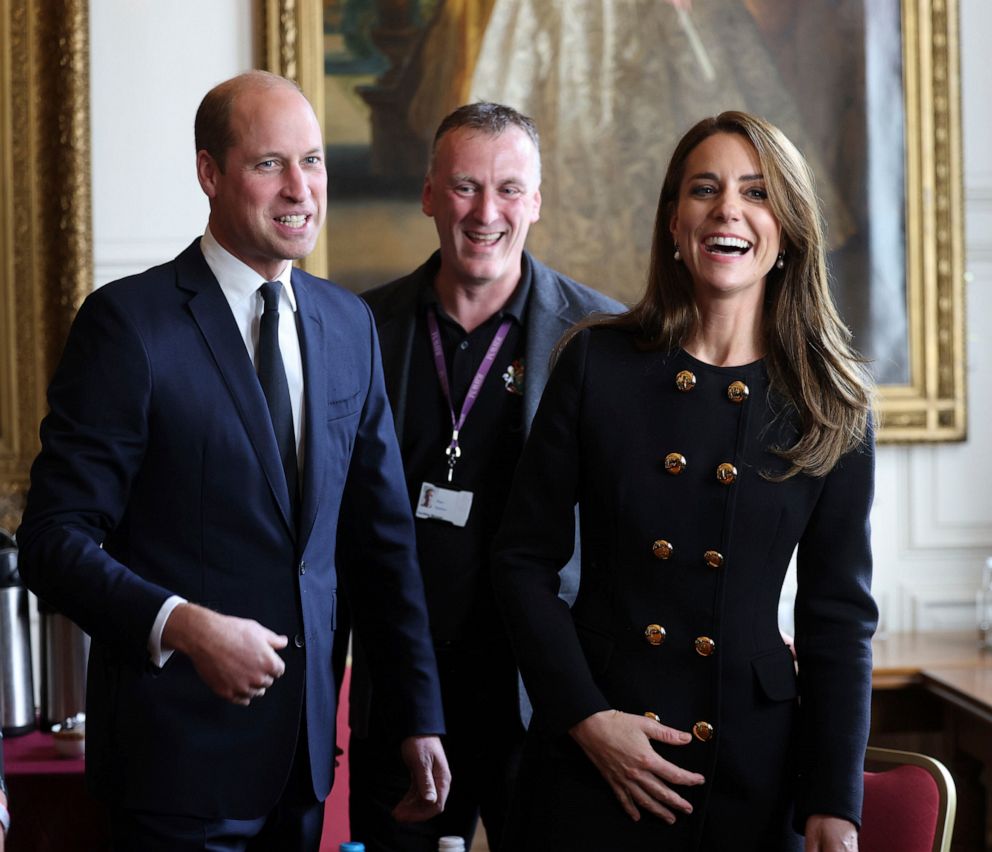 PHOTO: Prince William and Kate, Princess of Wales, meet volunteers and operational staff who were involved in facilitating the Committal Service for Queen Elizabeth II at St George's Chapel, at Windsor Guildhall, Berkshire, Sept. 22, 2022.