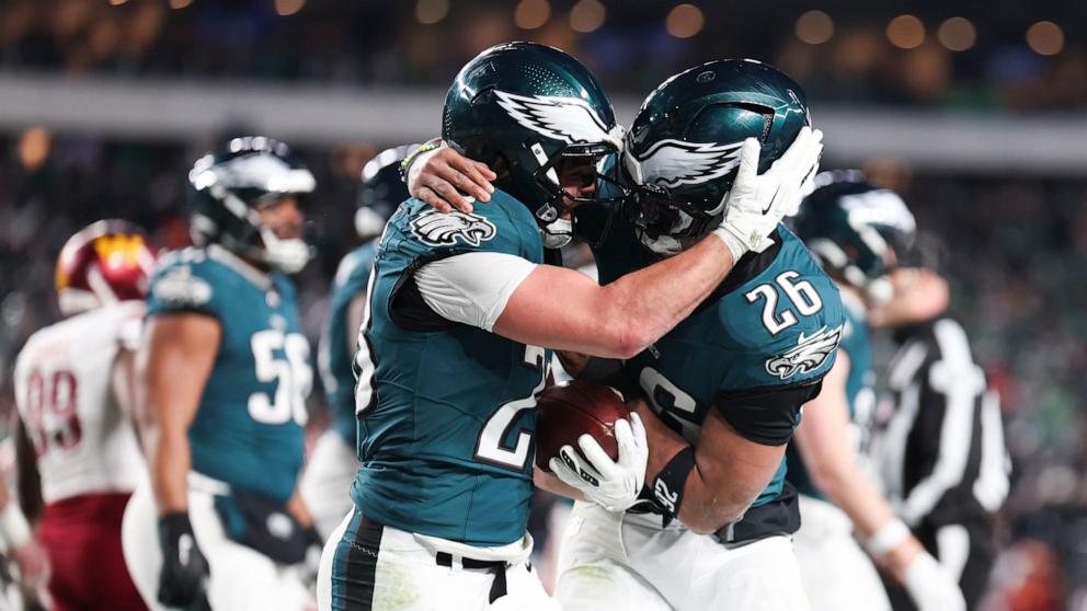 PHOTO: Will Shipley #28 of the Philadelphia Eagles celebrates with Saquon Barkley #26 of the Philadelphia Eagles after scoring a touchdown in the NFC Championship Game against the Washington Commanders in Philadelphia, Jan. 26, 2025.