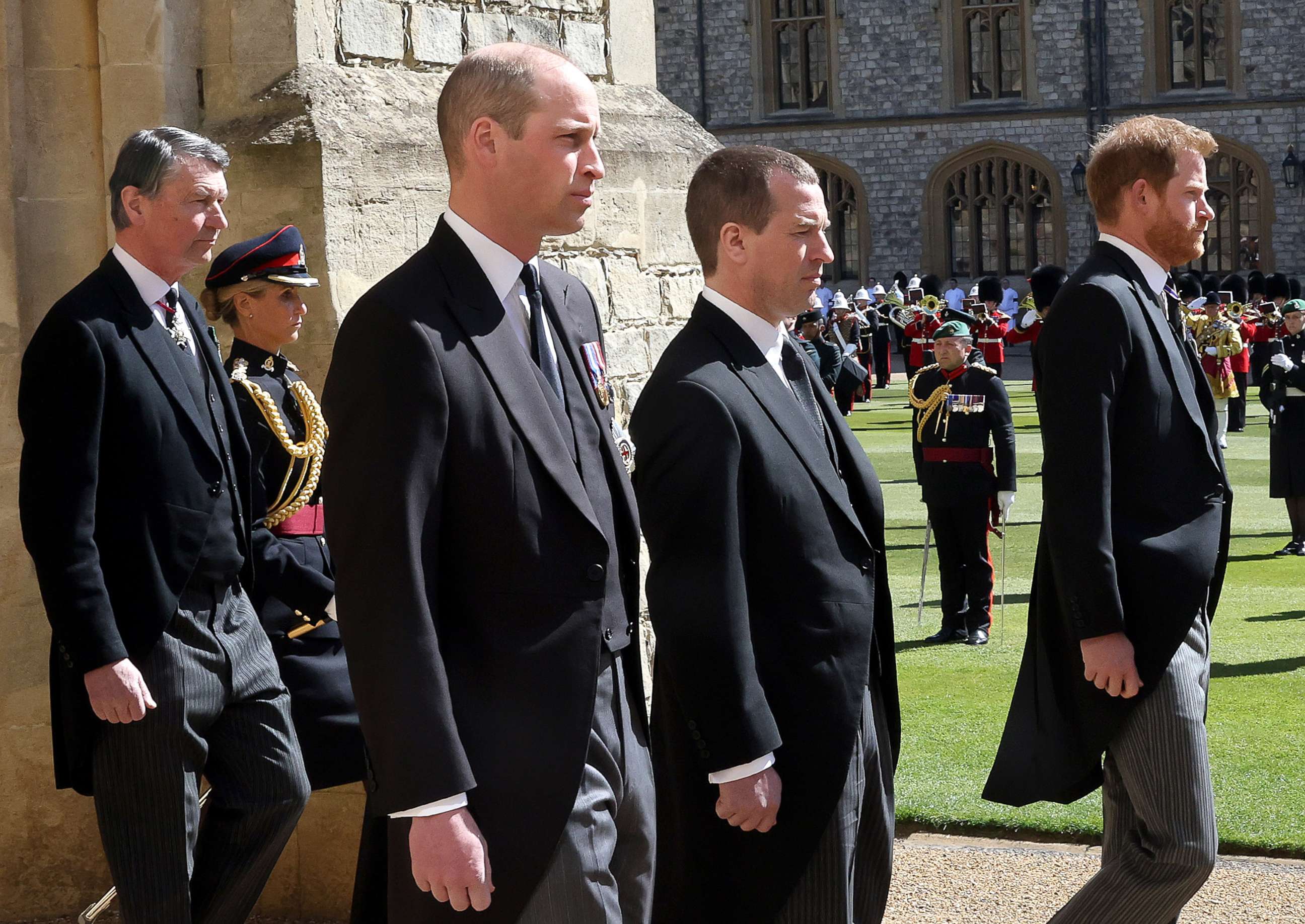PHOTO: Vice-Admiral Sir Timothy Laurence, Prince William, Duke of Cambridge, Peter Phillips, Prince Harry, Duke of Sussex follow Prince Philip during the Ceremonial Procession at Windsor Castle, April 17, 2021, in Windsor, England.