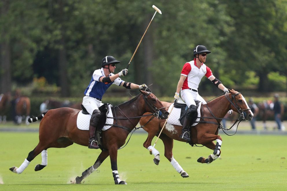 PHOTO: Prince William, Duke of Cambridge and Prince Harry, Duke of Sussex compete during the King Power Royal Charity Polo Day at Billingbear Polo Club on July 10, 2019 in Wokingham, England.