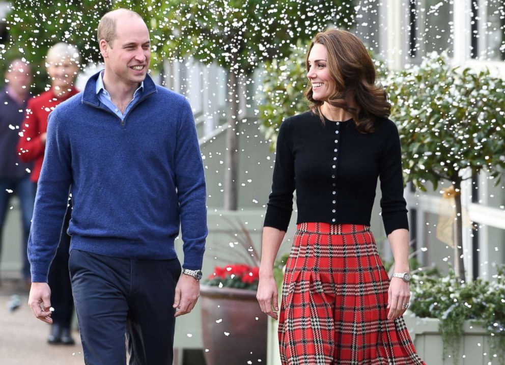PHOTO: Prince William, Duke of Cambridge and Catherine, Duchess of Cambridge laugh as a machine sprays snow at Kensington Palace, Dec. 4, 2018, in London. 