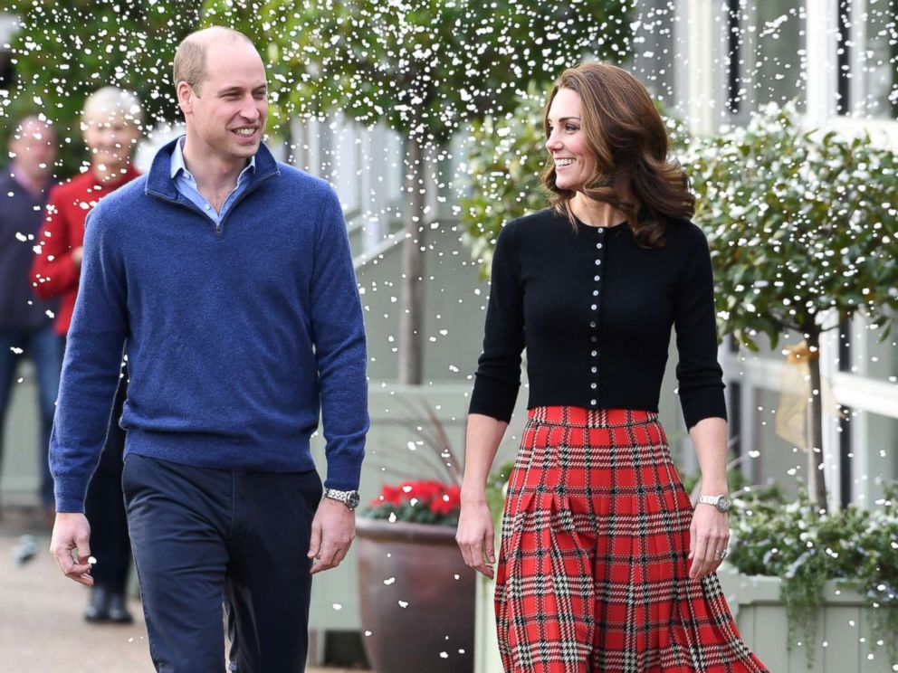 PHOTO: Prince William, Duke of Cambridge and Catherine, Duchess of Cambridge laugh as a machine sprays snow at Kensington Palace, Dec. 4, 2018, in London.
