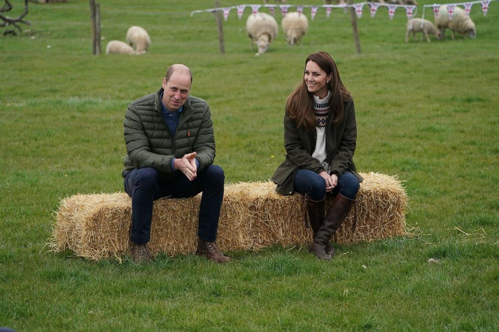 PHOTO: Prince William, Duke of Cambridge, and Catherine, Duchess of Cambridge, react during a visit to Manor Farm in Little Stainton, near Durham, England, on April 27, 2021.