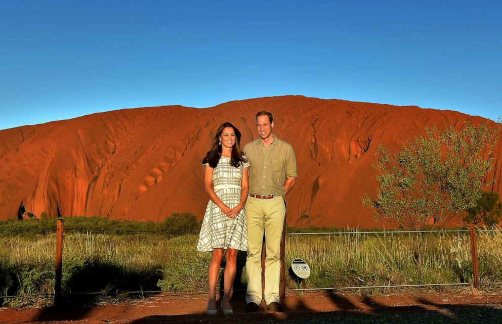 PHOTO: Catherine, Duchess of Cambridge and Prince William, Duke of Cambridge pose in front of Uluru, also known as Ayers Rock, on April 22, 2014, in Ayers Rock, Australia.