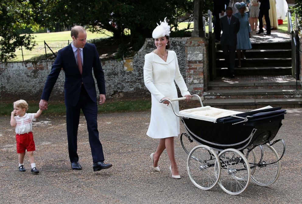 PHOTO: Catherine, Duchess of Cambridge, Prince William, Duke of Cambridge, Princess Charlotte of Cambridge and Prince George of Cambridge leave the Church of St Mary Magdalene for Prince Charlotte's christening on July 5, 2015, in King's Lynn, England.