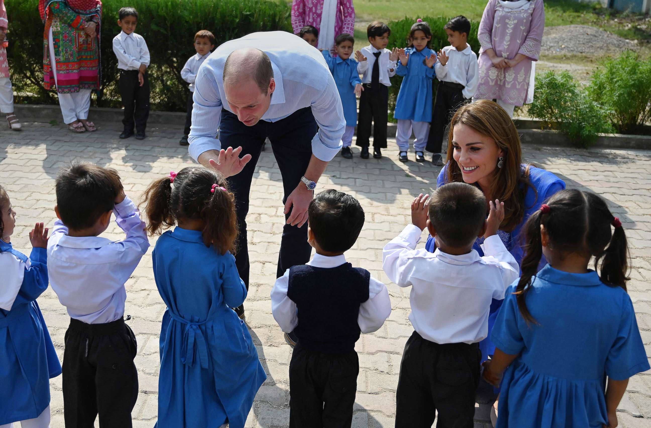 PHOTO: Britain's Prince William, Duke of Cambridge, and his wife Catherine, Duchess of Cambridge, meet with school children during their visit to a government-run school in Islamabad, Oct. 15, 2019.