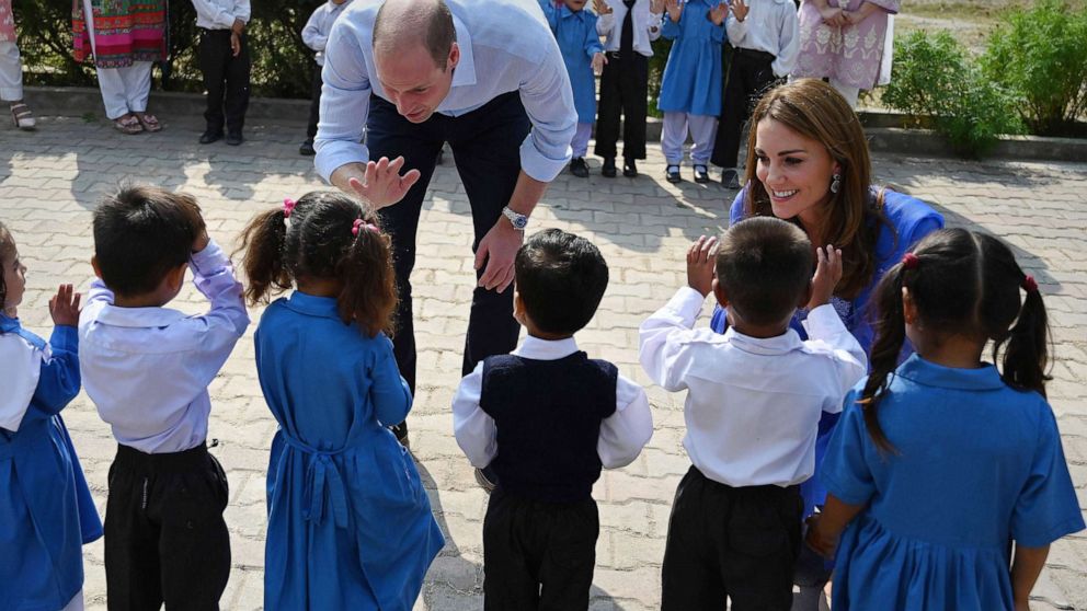 PHOTO: Britain's Prince William, Duke of Cambridge, and his wife Catherine, Duchess of Cambridge, meet with school children during their visit to a government-run school in Islamabad, Oct. 15, 2019.