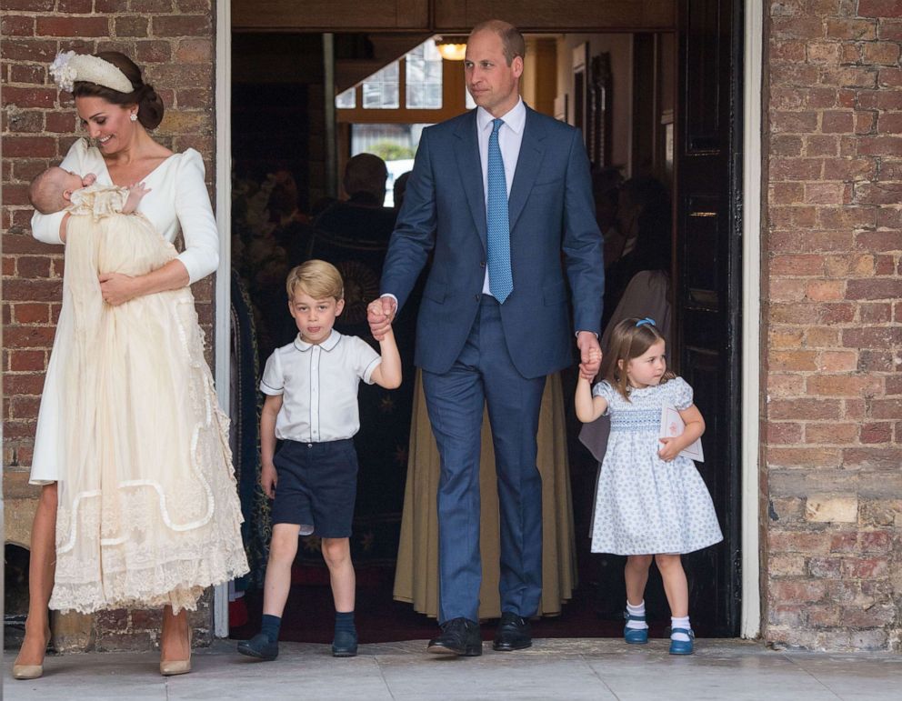 PHOTO: Princess Charlotte and Prince George hold hands with Prince William, Duke of Cambridge, as Prince Louis is carried by Catherine, Duchess of Cambridge after his christening service at the Chapel Royal, St James's Palace, London, on July 9, 2018.
