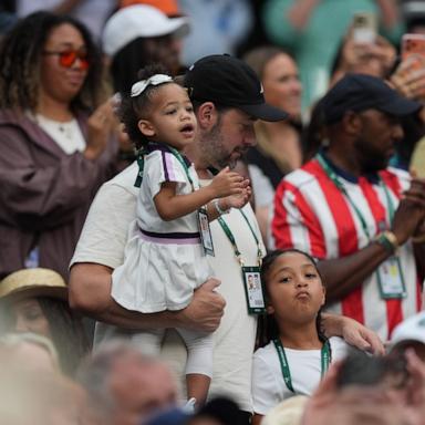 PHOTO: Alexis Ohanian stand with their daughters Olympia and Adira on the stands, as they wait to watch the first round women's singles match between Serena Williams and Maya Joint at the Wimbledon Tennis Championships in London, June 30, 2026.