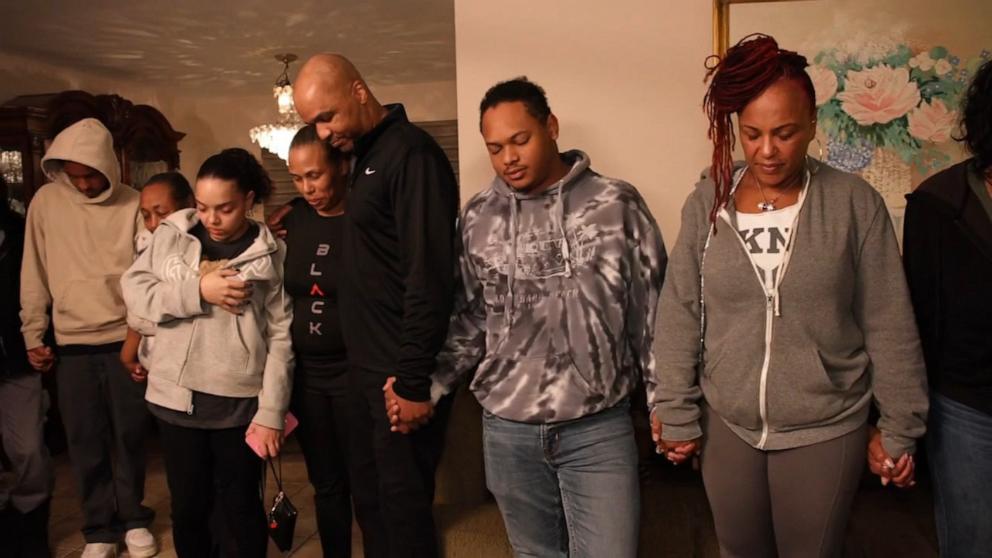 PHOTO: The Williams family prays before having dinner after losing their homes in the California wildfires.