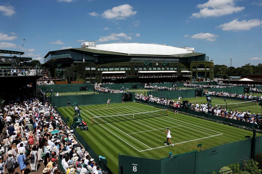 PHOTO: A general view of play over court eight as Yue Yuan of People's Republic of China plays against Eva Lys of Germany during their Ladies' Singles first round Wimbledon Championships match, June 30, 2025, in London.