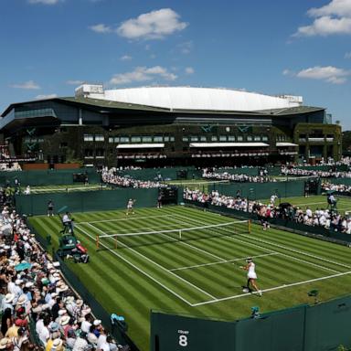 PHOTO: A general view of play over court eight as Yue Yuan of People's Republic of China plays against Eva Lys of Germany during their Ladies' Singles first round Wimbledon Championships match, June 30, 2025, in London.