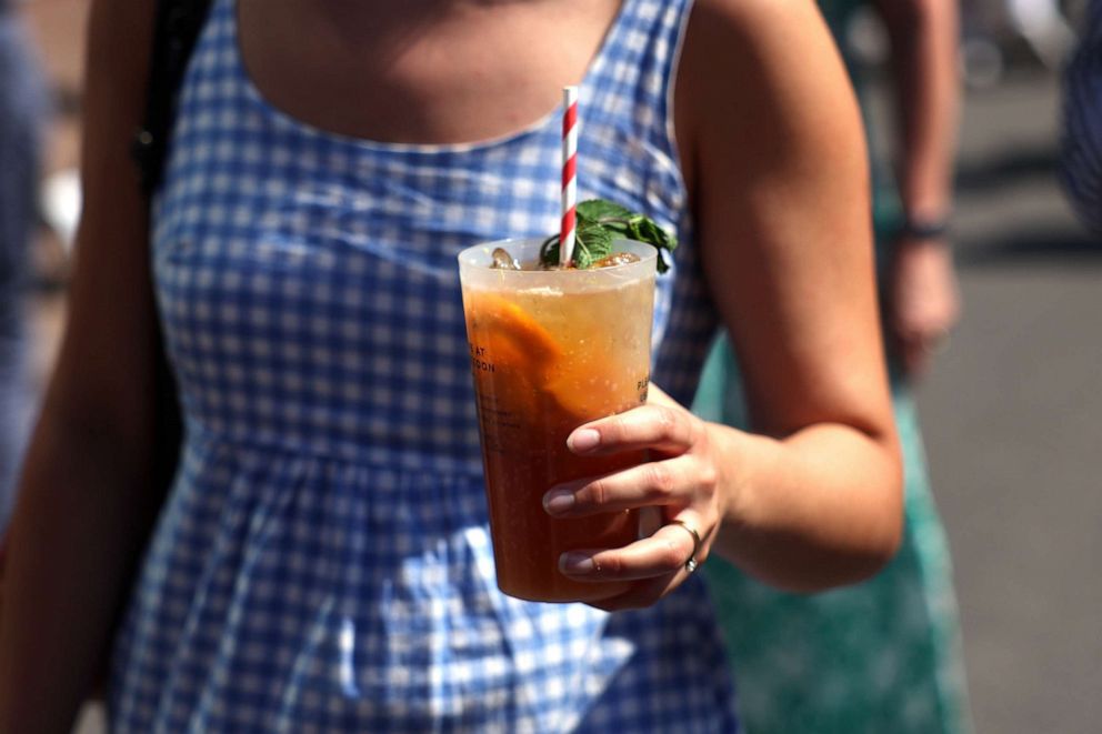PHOTO: A spectator holds a Pimm's cup during day five of The Championships Wimbledon 2023, July 7, 2023, in London.
