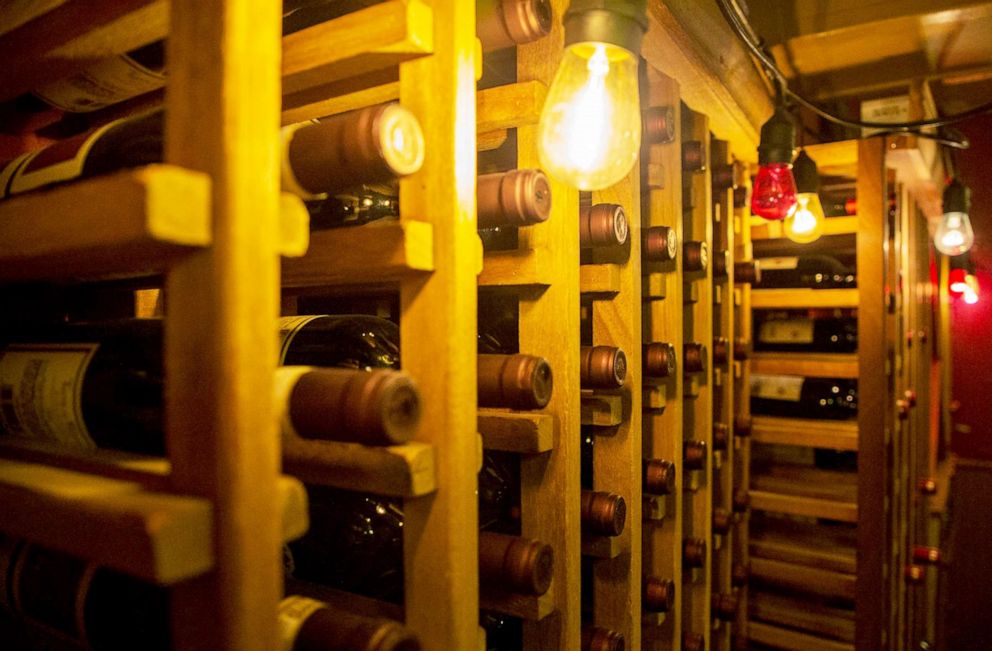 PHOTO: Wine bottles are stored in the wine cellar of Lombardi's Pizza  in New York, July 7, 2020.
