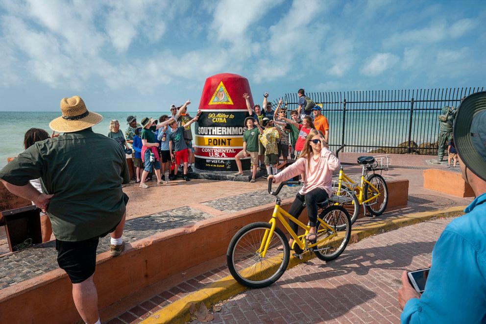 PHOTO: Island visitors gather at the Southernmost Point bouy in Key West, Fla., March 25, 2021.