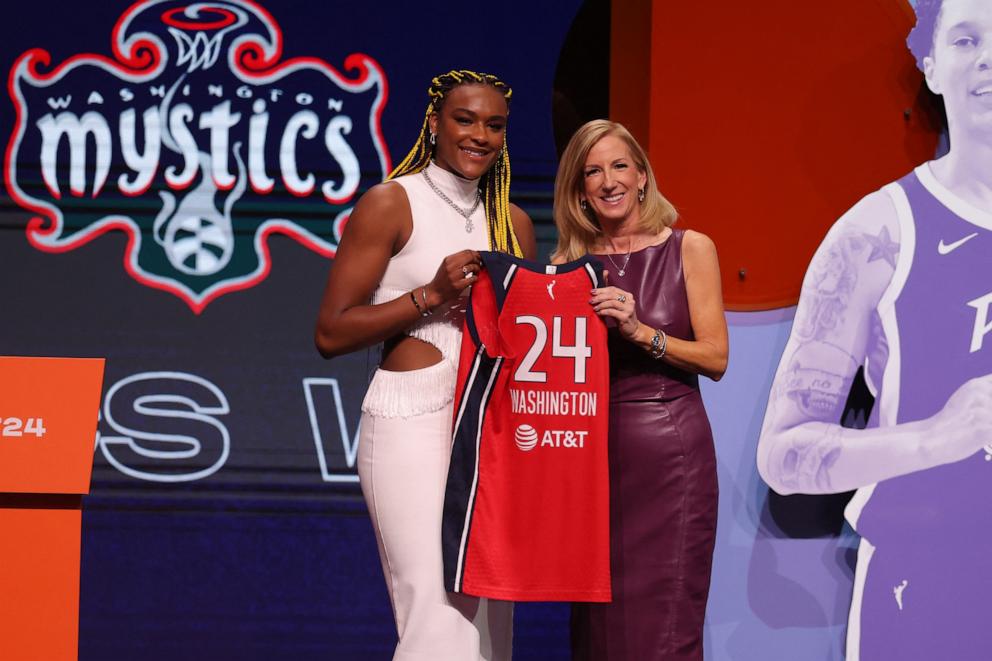 PHOTO: Aaliyah Edwards poses with WNBA commissioner Cathy Engelbert after she is selected with the number six overall pick to the Washington Mystics in the 2024 WNBA Draft at Brooklyn Academy of Music,  April 15, 2024, Brooklyn, New York.