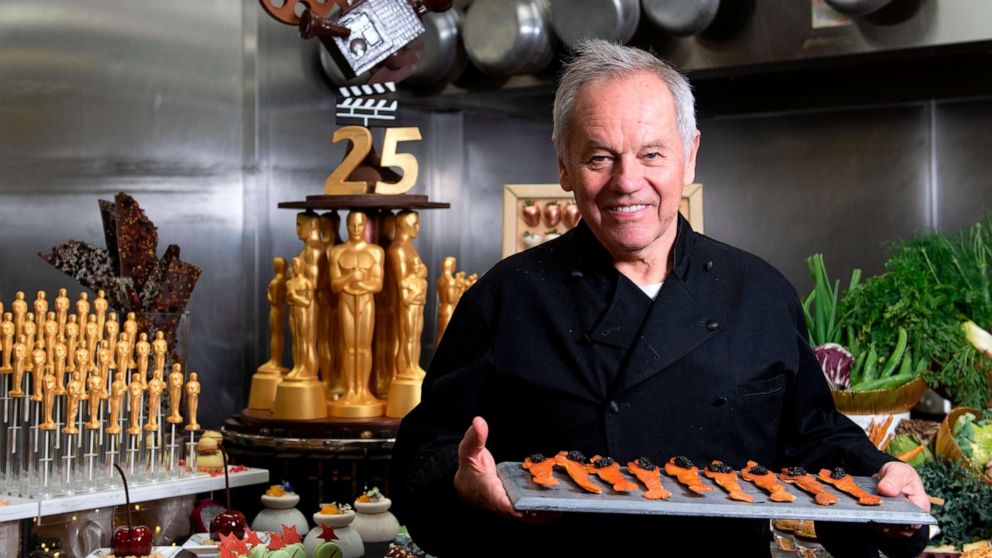 In this Feb. 20, 2019, file photo, celebrity chef Wolfgang Puck poses in the kitchen while preparing the dinner for the 91st annual Academy Awards Governors Ball, in Hollywood, Calif.