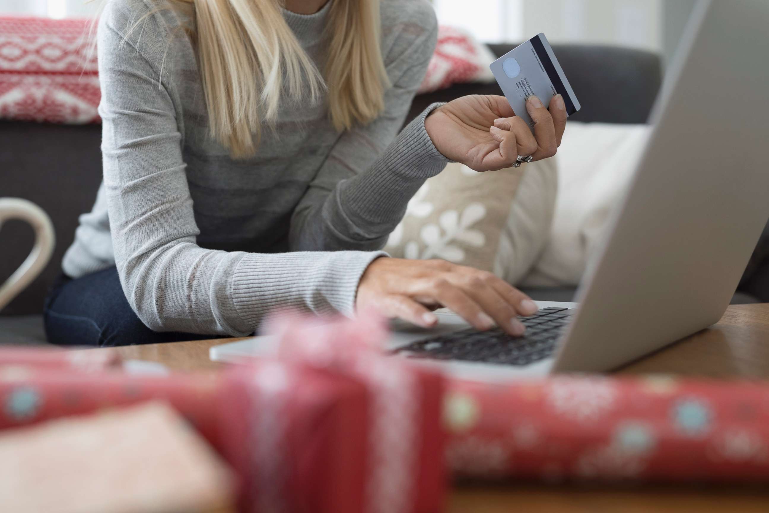 PHOTO: A stock image depicts a woman shopping for holiday presents online.