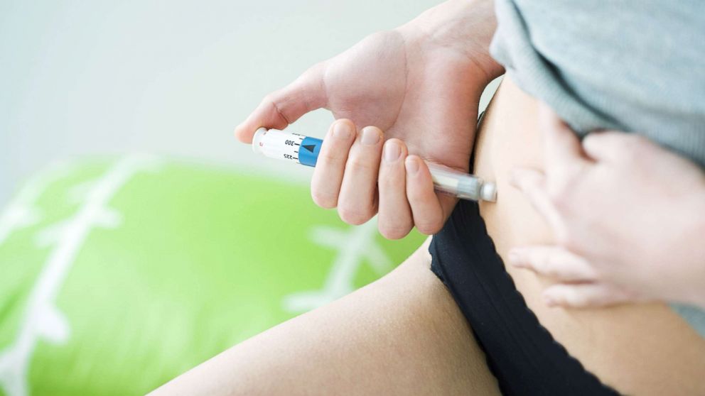 PHOTO: An undated stock photo depicts a woman giving herself an injection.