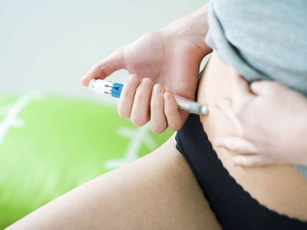 PHOTO: An undated stock photo depicts a woman giving herself an injection.