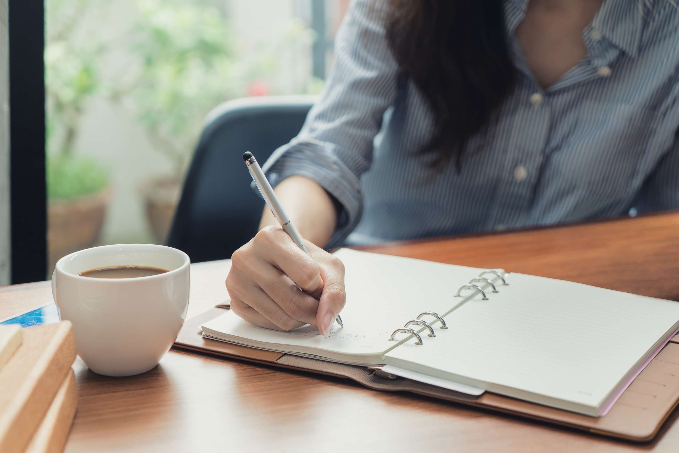 PHOTO: A woman appears to be writing in her journal in this stock photo.