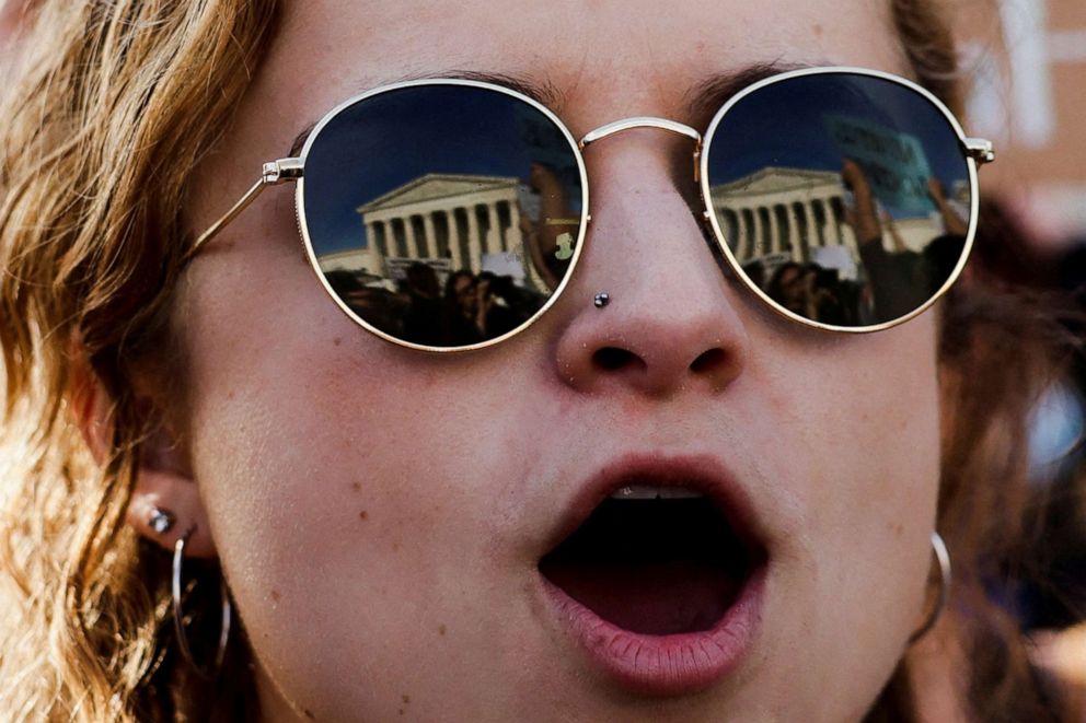 PHOTO: The U.S. Supreme Court is reflected on the sunglasses of Hannah Fuller, 25, during a protest after the leak of a draft to overturn the landmark Roe v. Wade abortion rights decision, May 3, 2022.